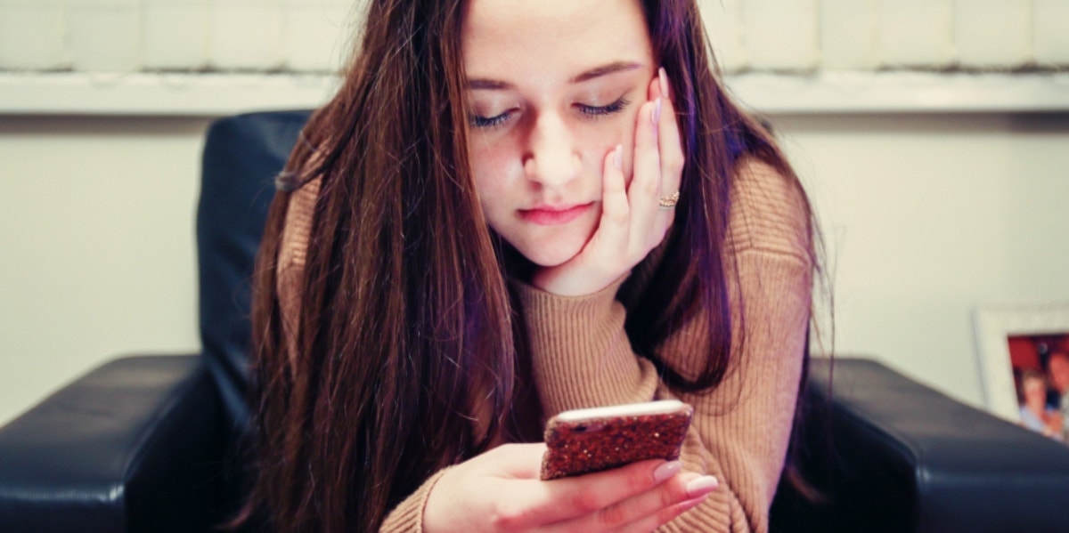 woman scrolling on phone