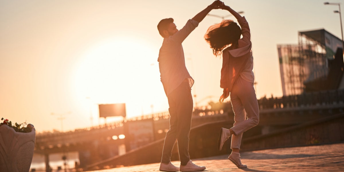 Why Sometimes Fairy Tales Are Better Without A Happy Ending couple dancing in sunlight