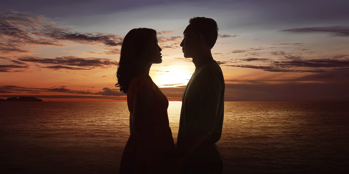 couple silhouette in front of the sunset