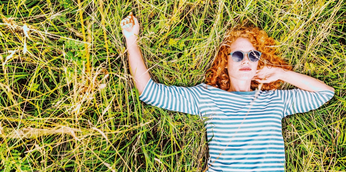 woman lying on the grass