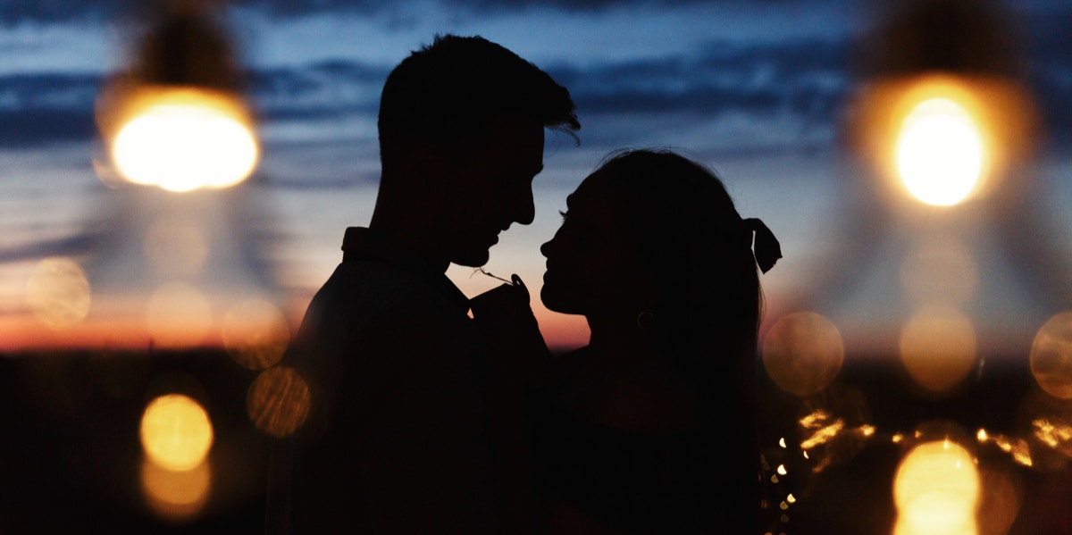 silhouette of couple at night
