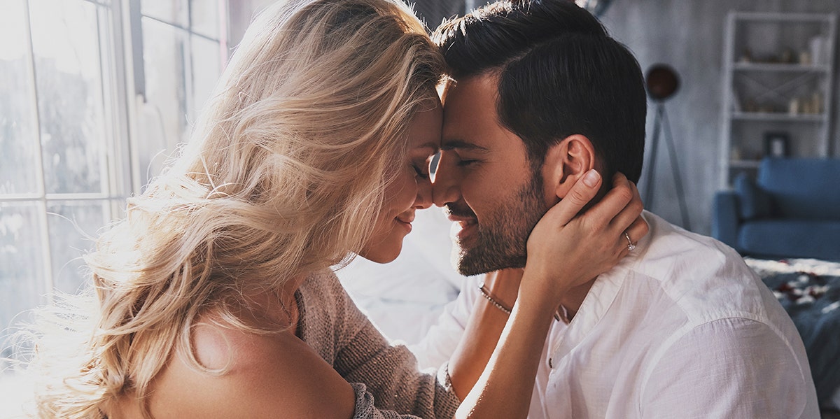 How Long It Actually Takes Men To Fall In Love couple touching their foreheads together