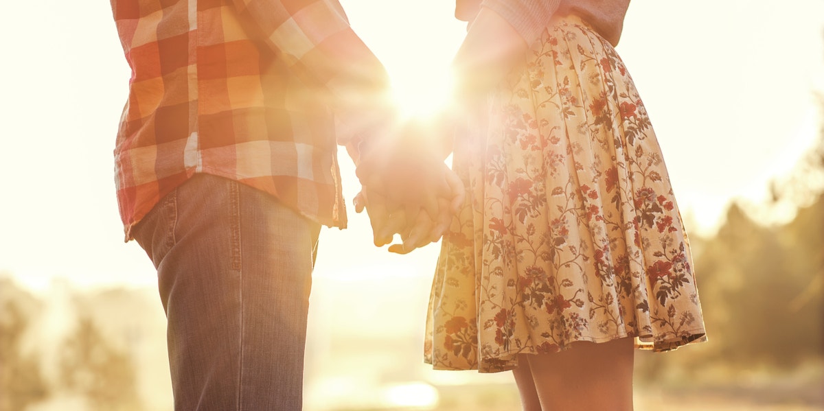 man and woman holding hands