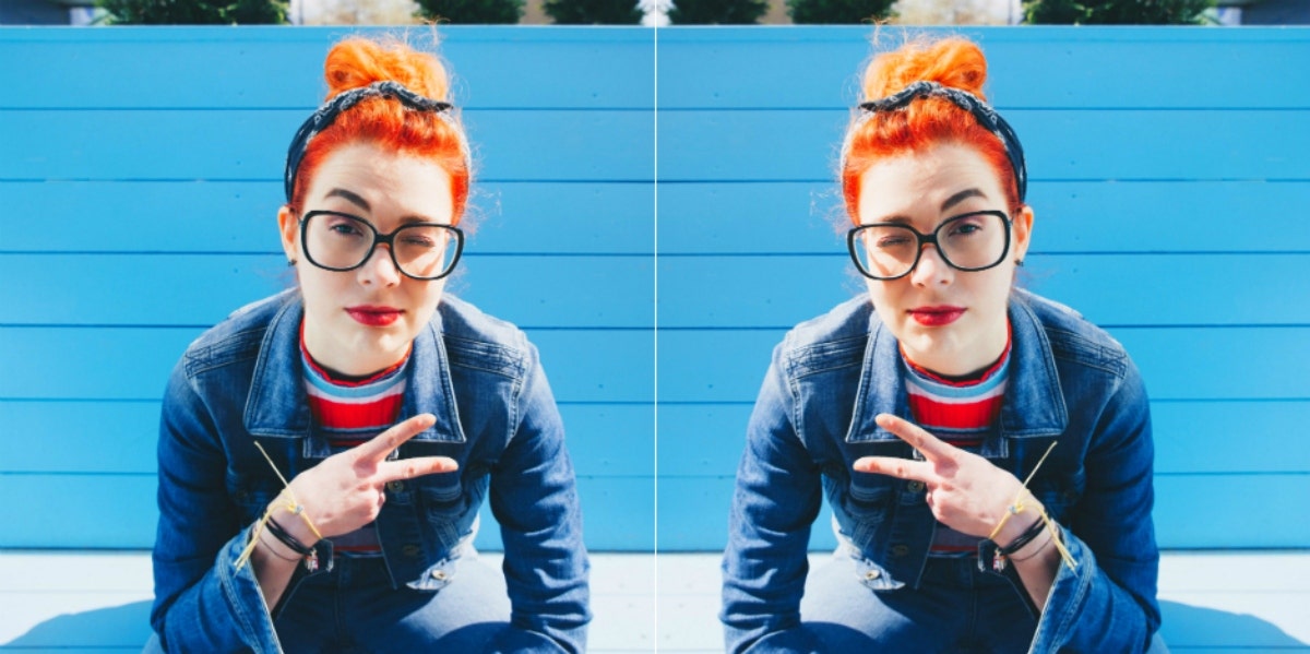 woman holding up a peace sign