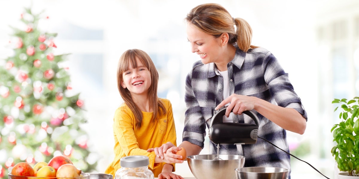 mom and daughter baking for Christmas