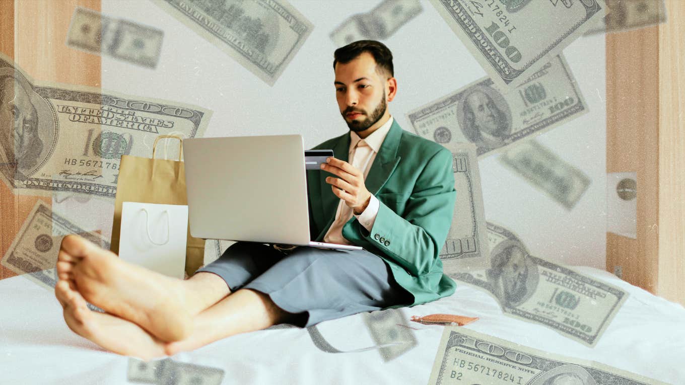 Man sitting in bed surrounded by bags and money online shopping
