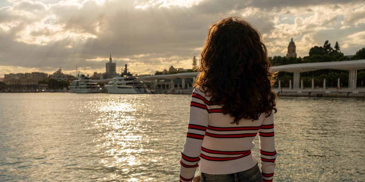 woman looking at lake