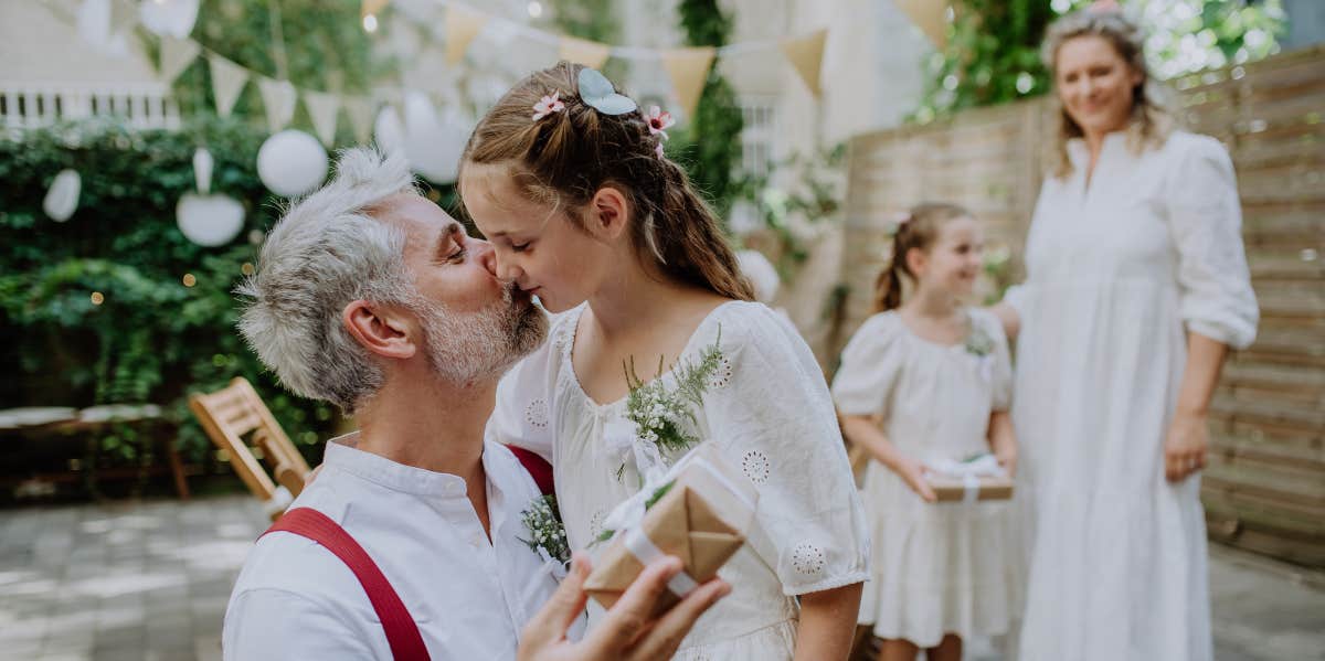 Groom and his daughter at a wedding