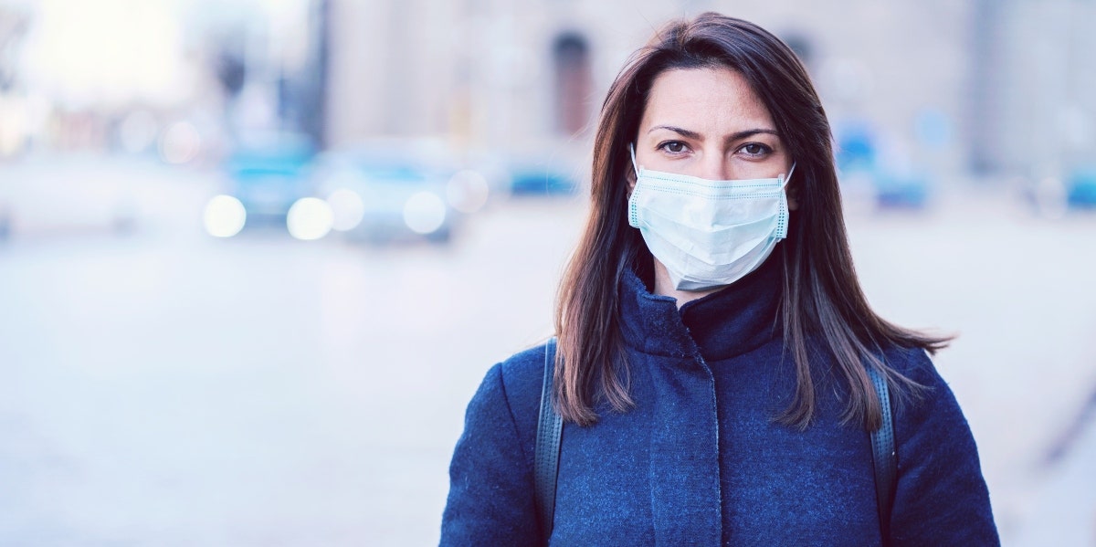 fear of death woman wearing a mask