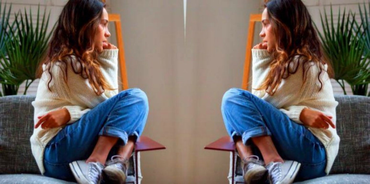 How To Deal With A Constant Fear Of Losing Your Job worried woman sitting on a chair