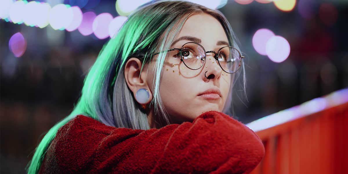 woman with blue hair looking up