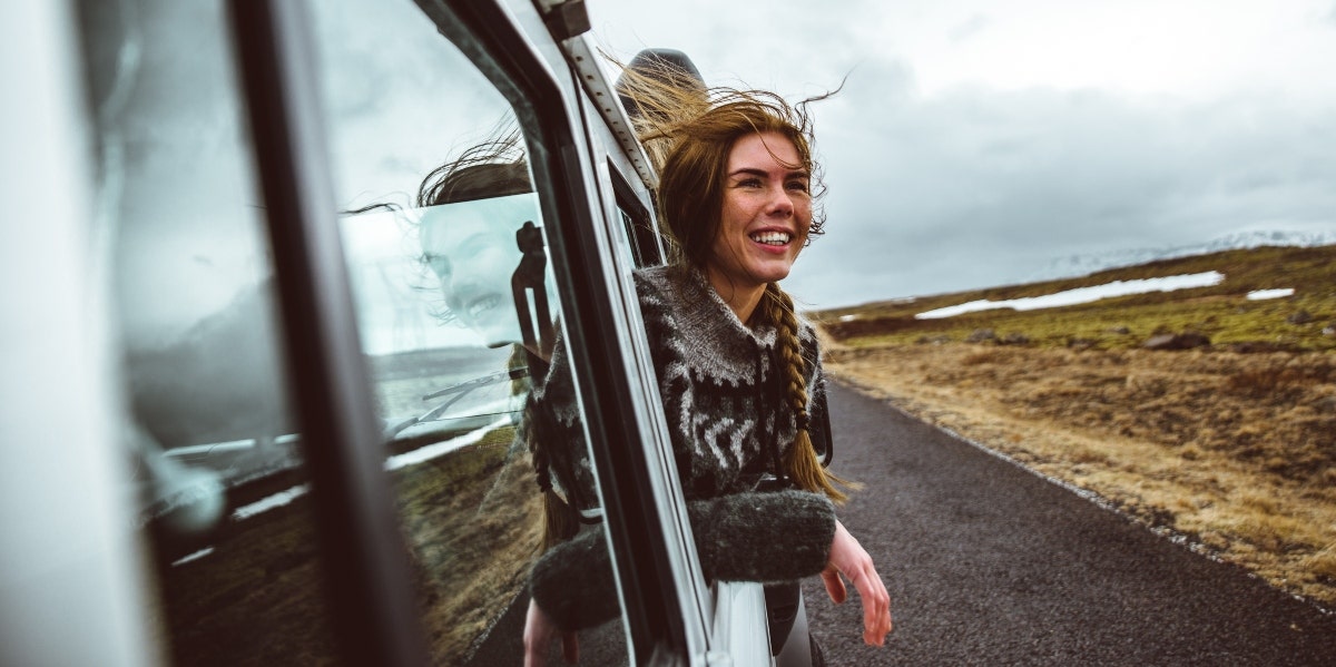 woman looking out of a van