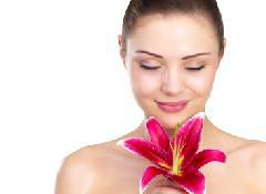 3 Secrets To Exuding Sexy woman smelling flower