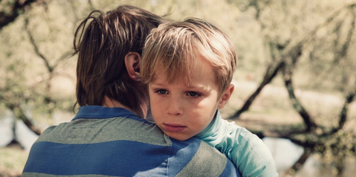fighting in front of children sad boy hugging father