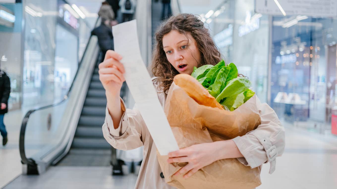 woman shocked by her grocery receipt