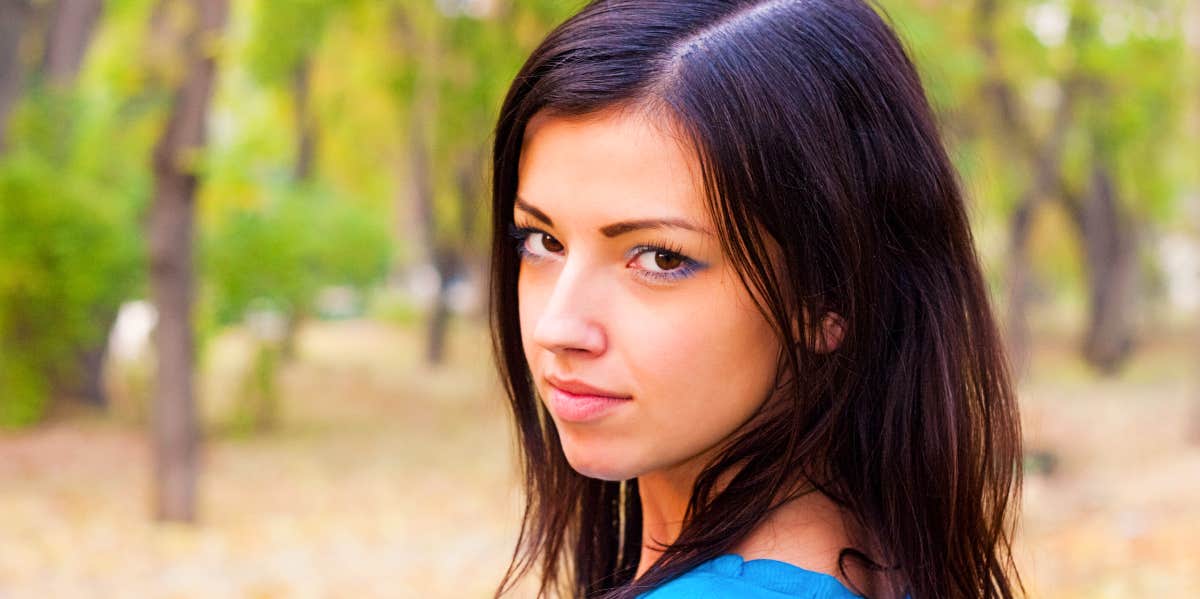 Young woman looks intensely at the camera.
