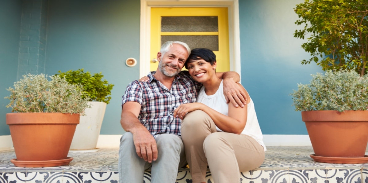 older couple sitting on front porch