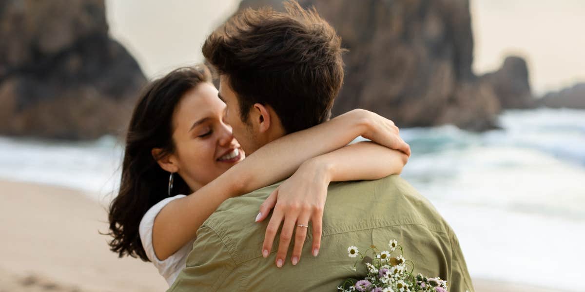 couple hugging on the beach