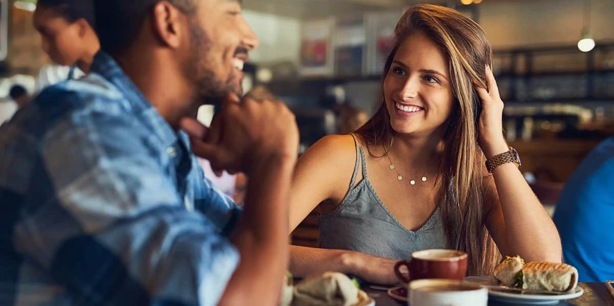 woman smiling at man on a first date