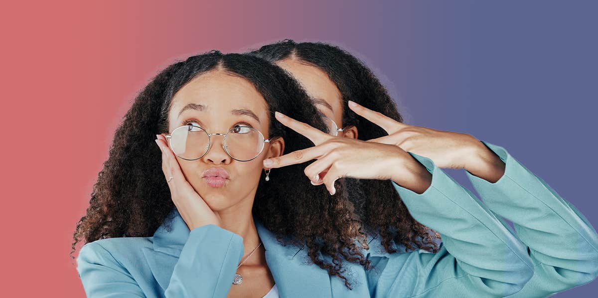 Woman wearing glasses making a peach sign