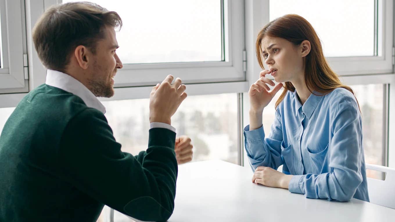 woman looking uncomfortable during a conversation