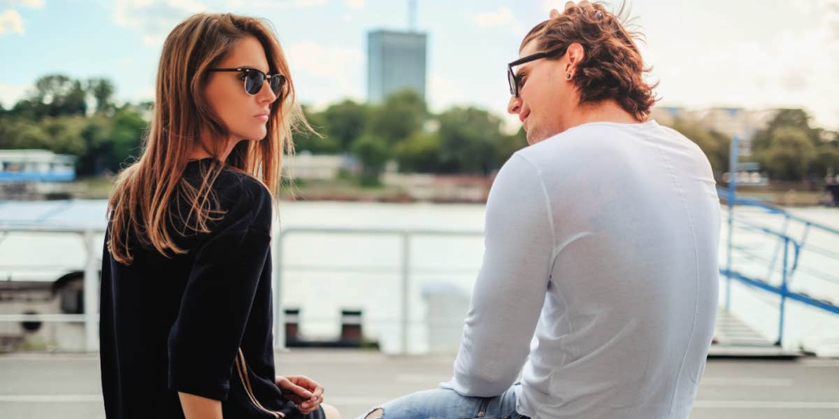 man and woman sitting talking