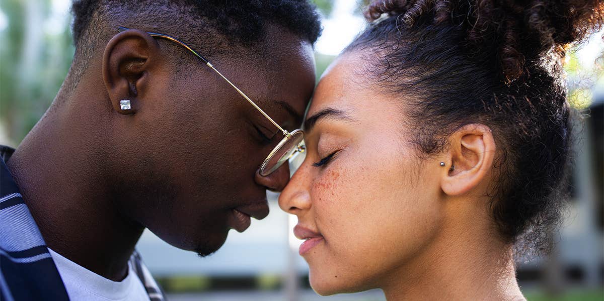 man and woman embracing face to face