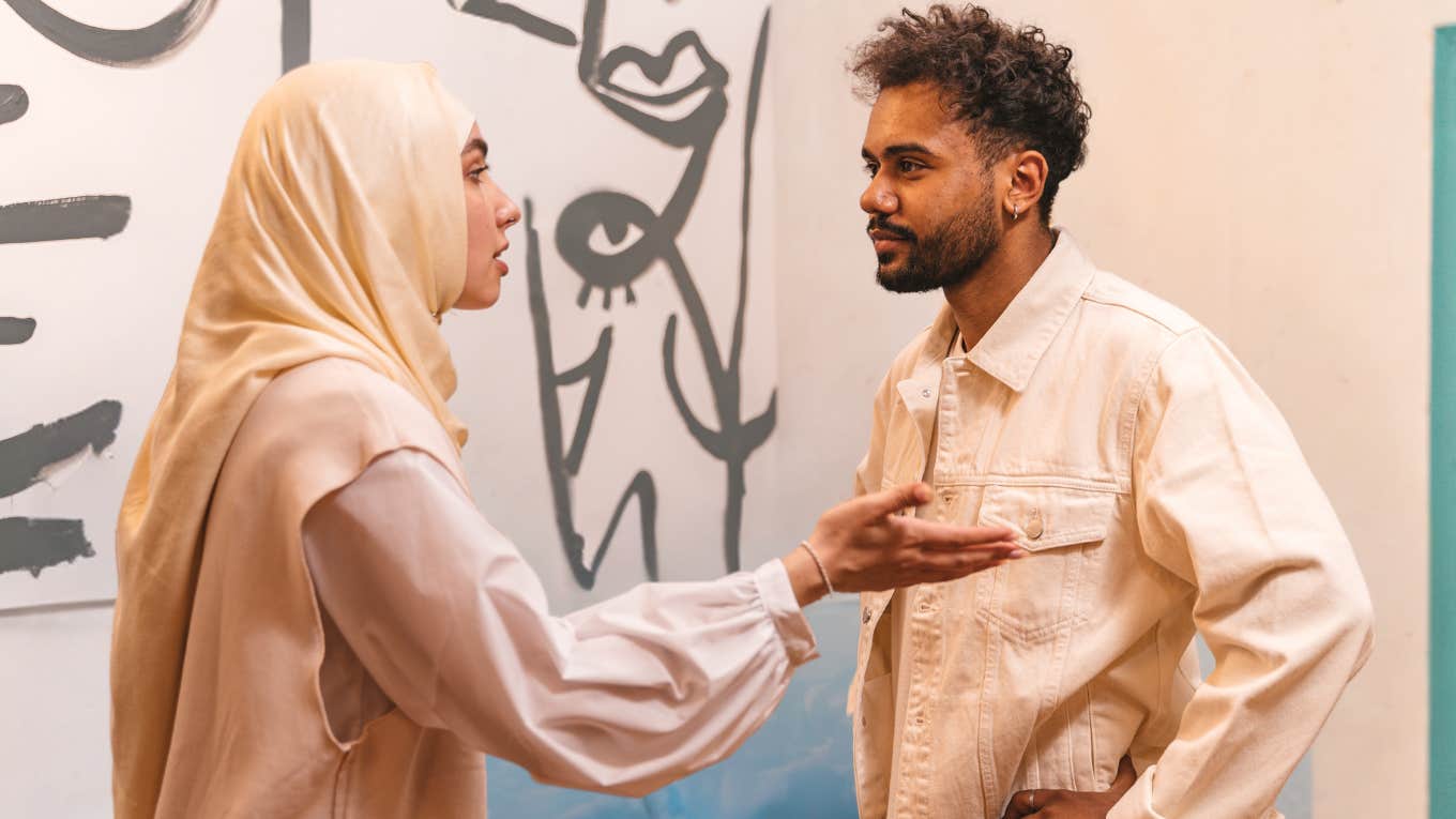 Man and woman arguing face to face. 