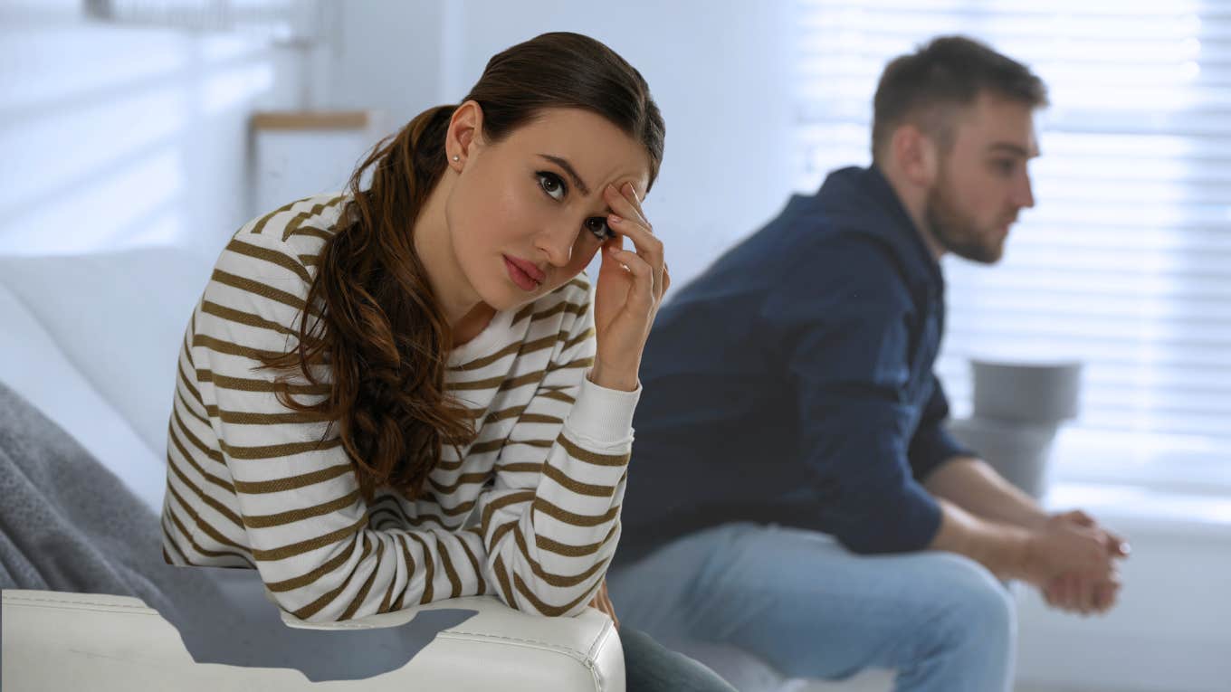 Woman looking annoyed while turned away from a man. 