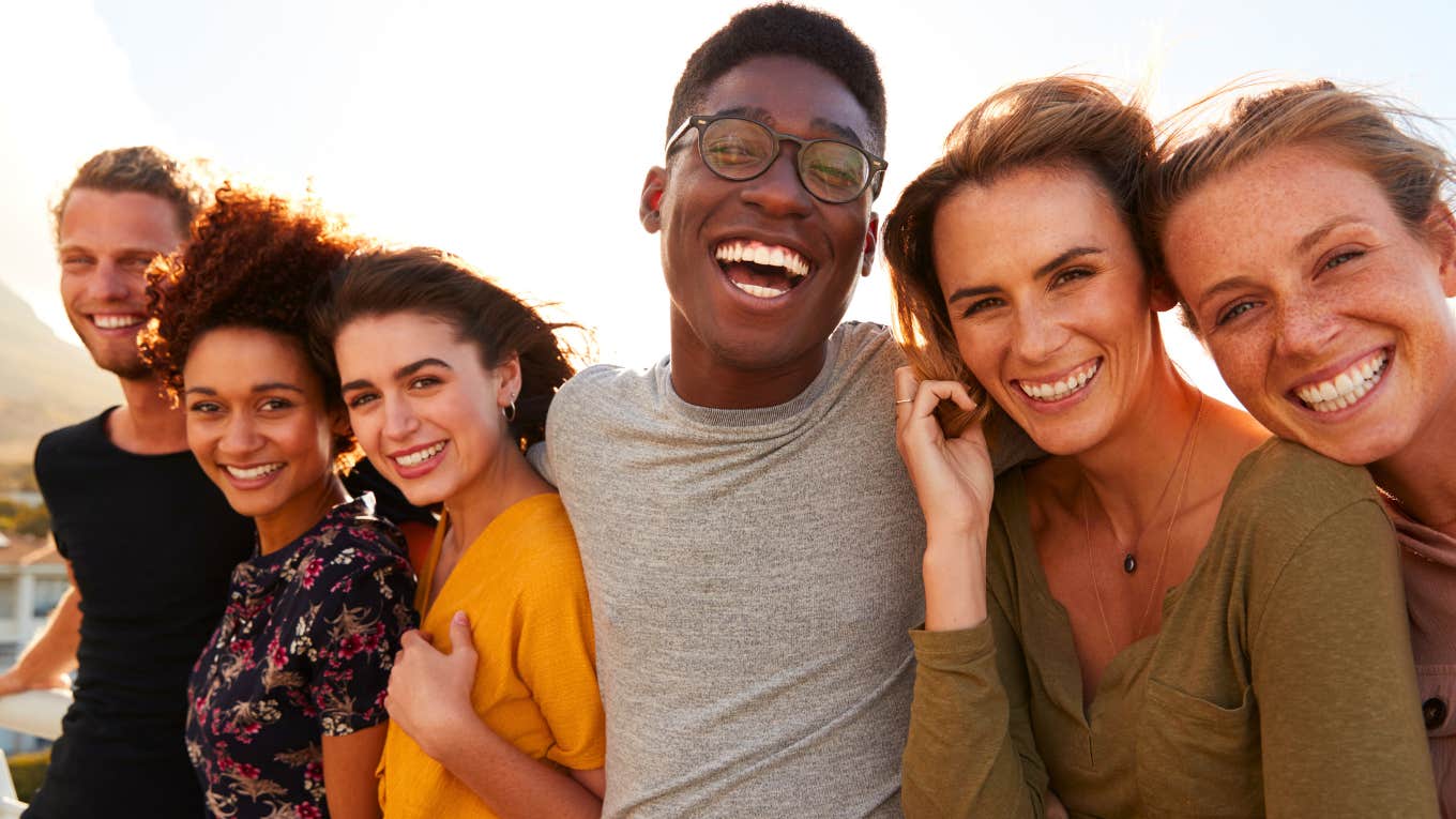 If We Fixed Even 2 Of These 11 Things, Life Would Be Easier For Everyone Portrait of smiling young friends walking outdoors together