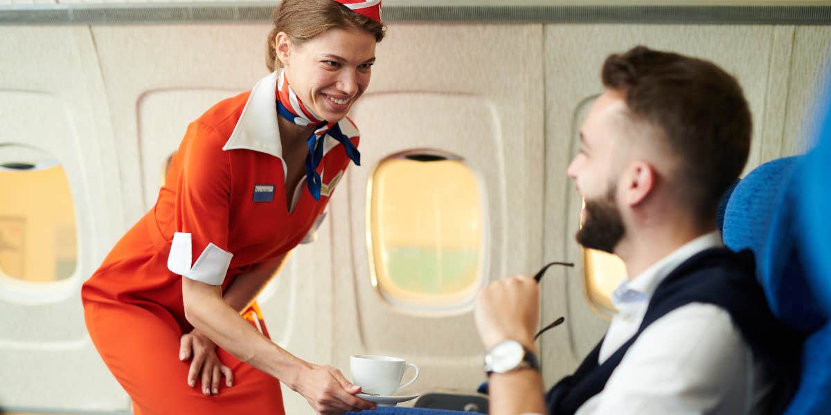 Flight attendant serving tea