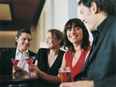 woman and man flirting in a bar