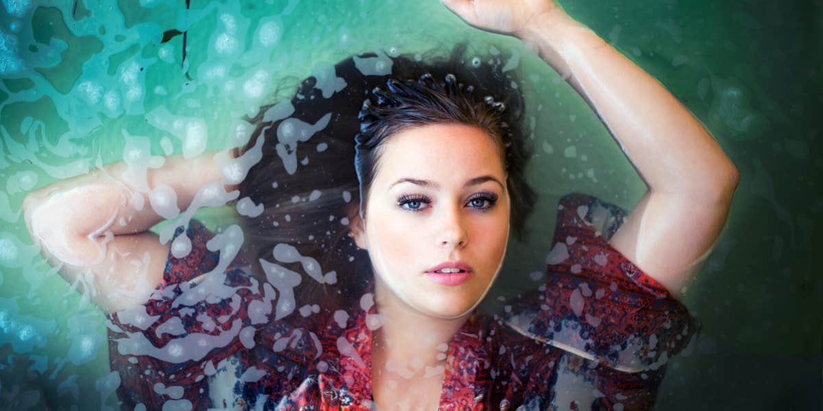 I Tried Flotation Therapy And Here’s What Happened woman floating in water