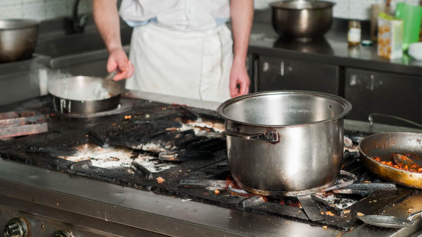 line cook cooks on dirty kitchen surface