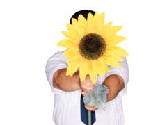 man holding giant sunflower