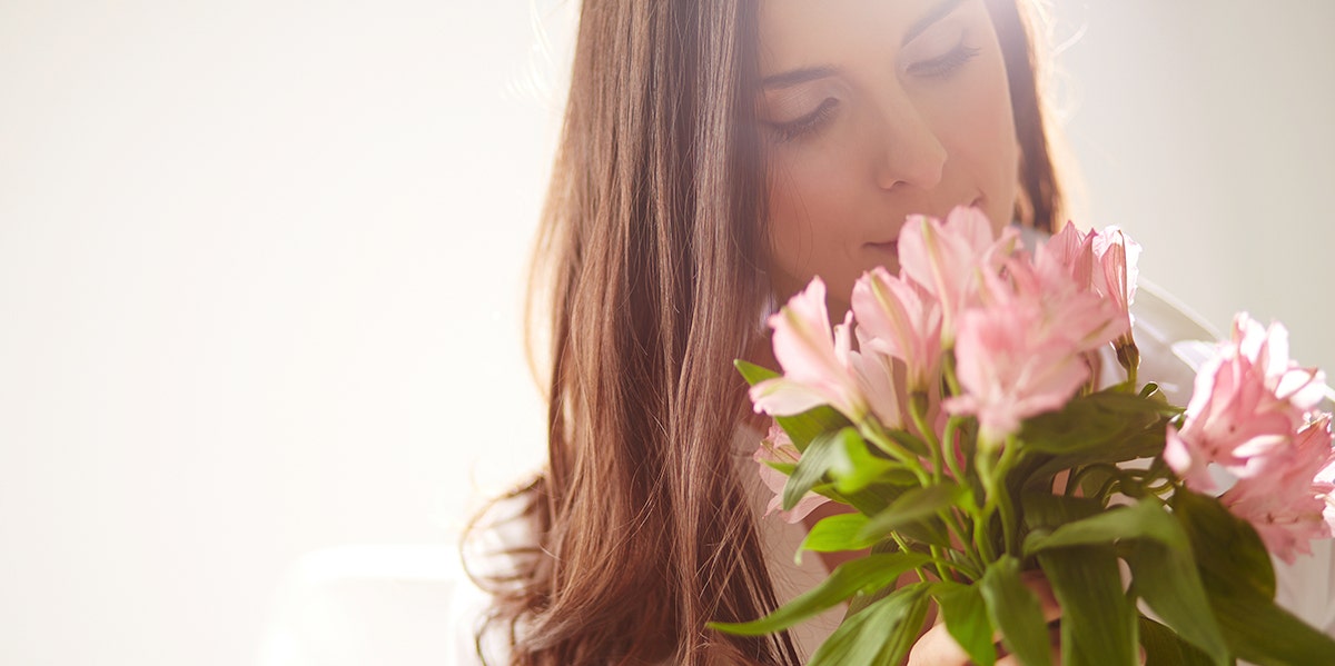 Why I Don't Like It When My Husband Buys Me Flowers woman with flowers
