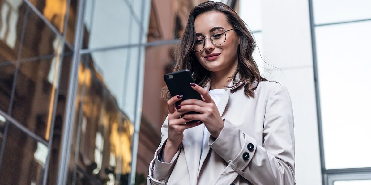 smiling woman on phone