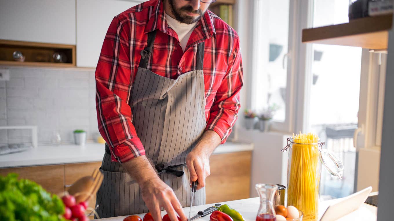 man in apron cooking