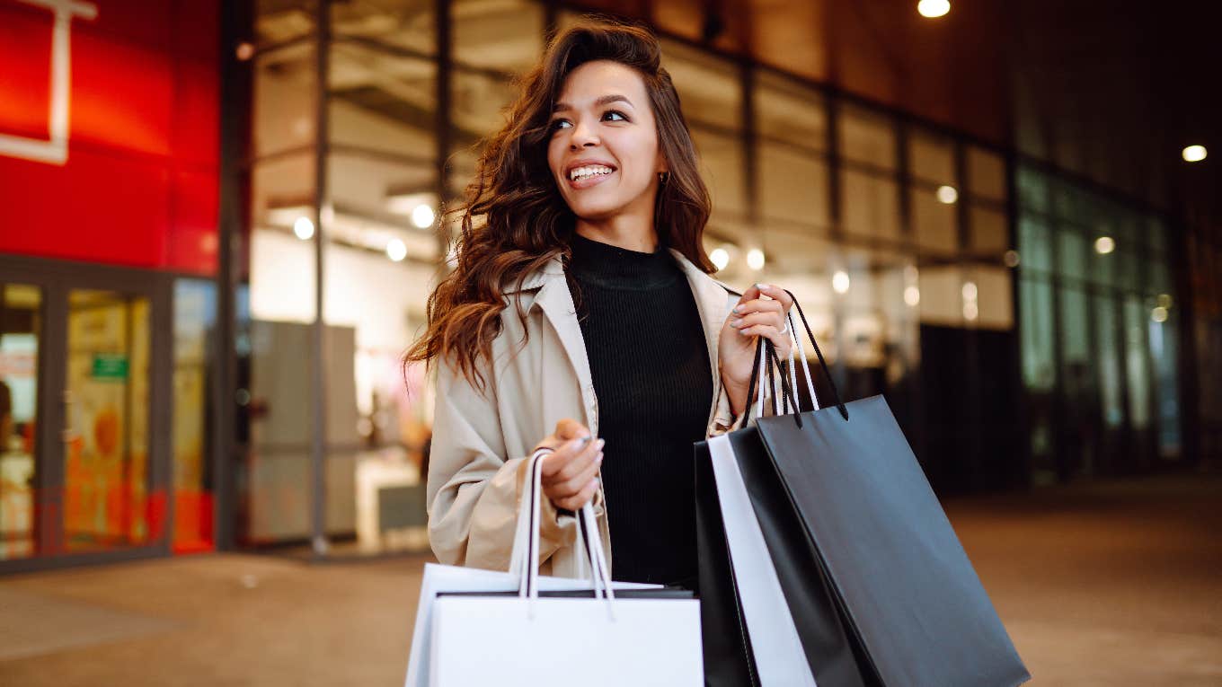 shopaholic carrying shopping bags