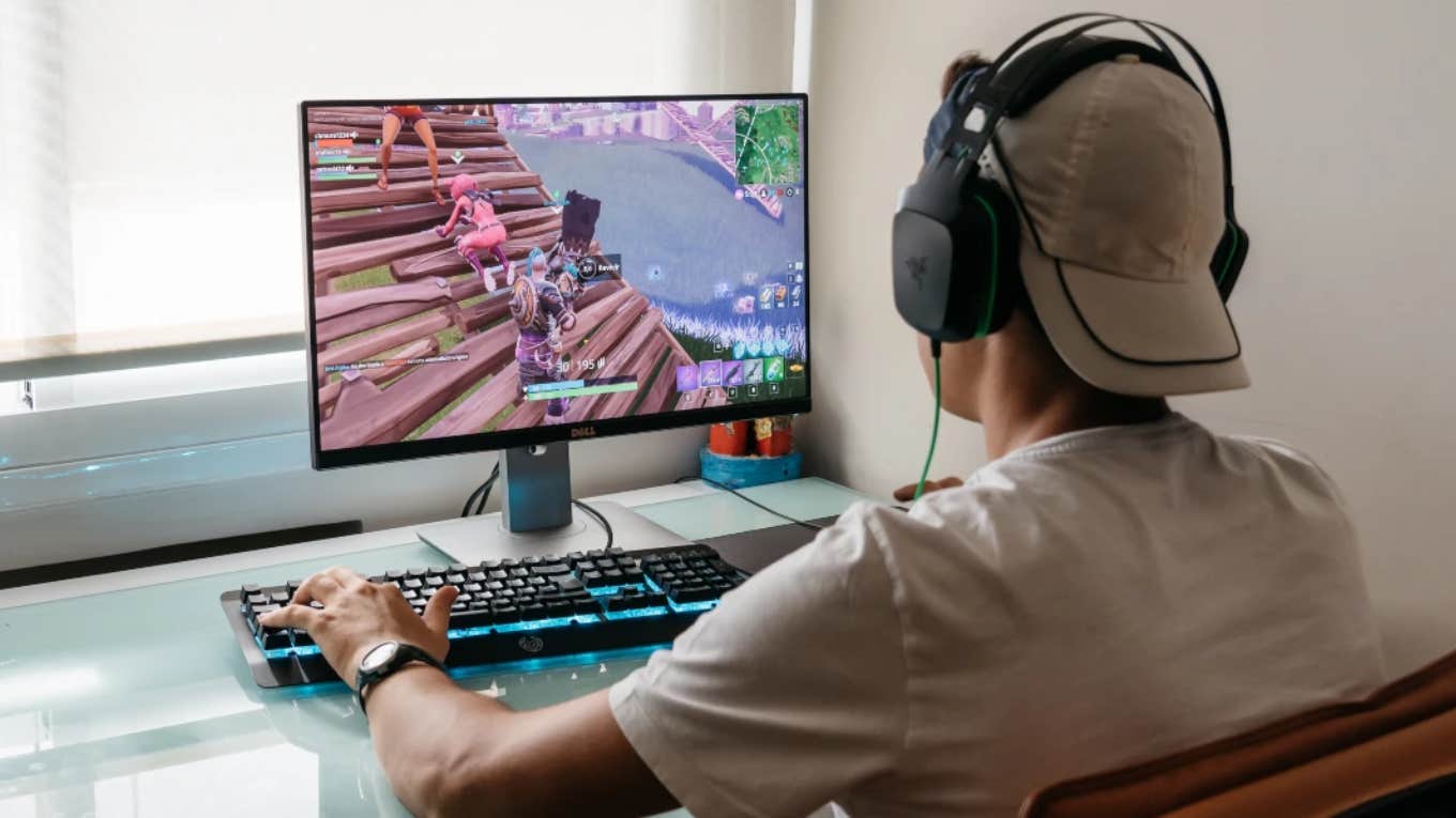 teenage boy gaming on computer