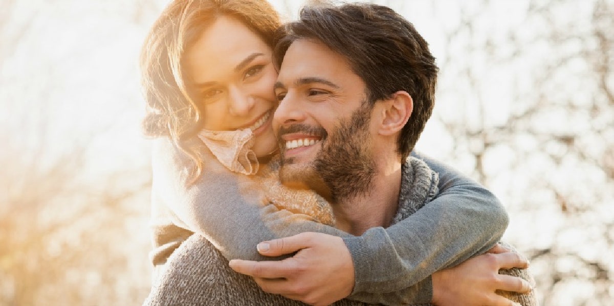 man and woman hugging 