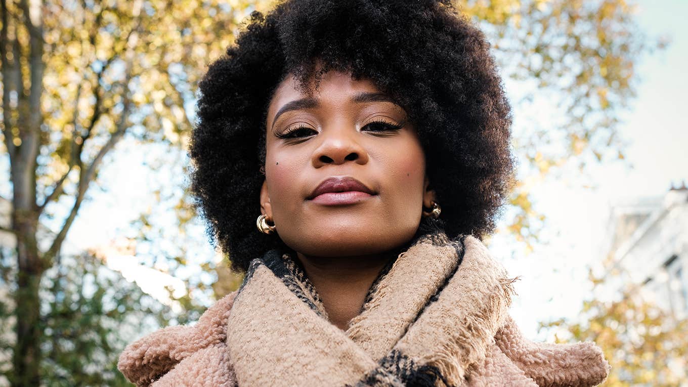 woman wearing scarf outside under trees