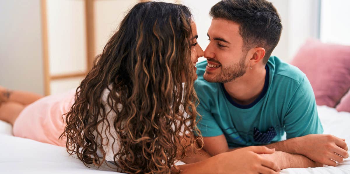 Most Common Lies People Tell Before Sex, Says Scary Study couple talking on bed