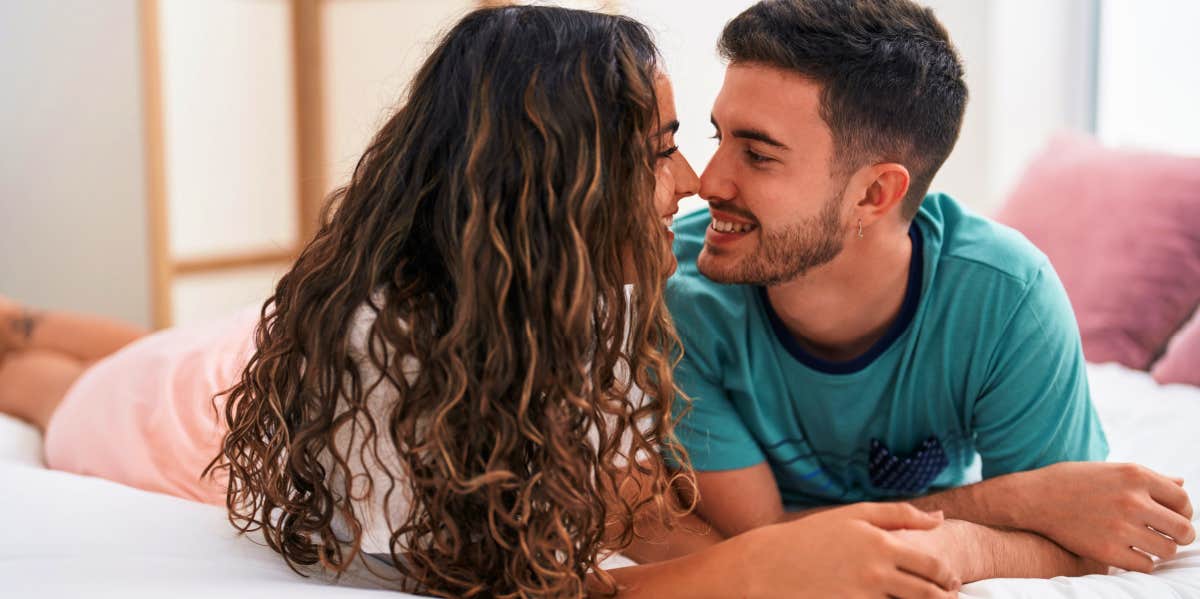 couple talking on bed