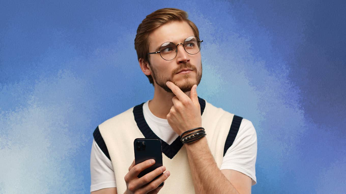 4 Phrases People Pleasers Can Use When People Take Advantage of Them Man contemplates while looking at his cell phone.