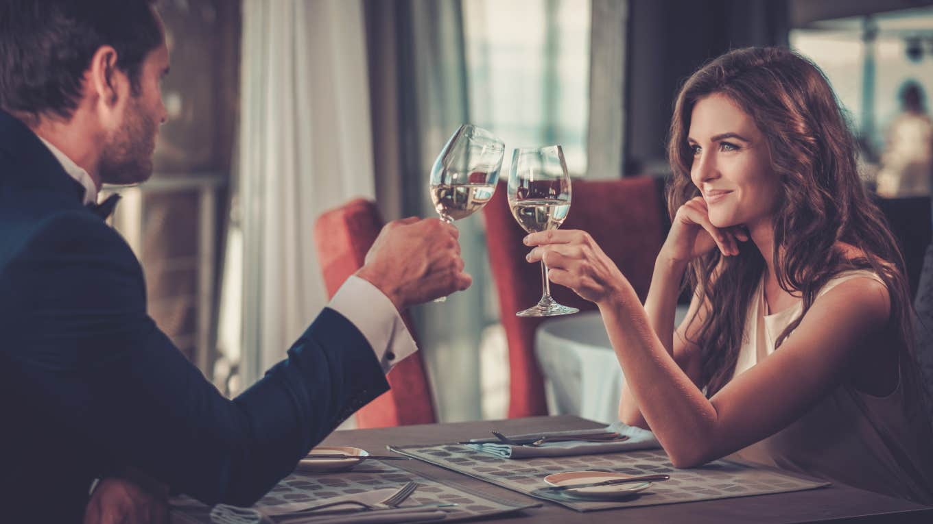 man and woman on date at restaurant