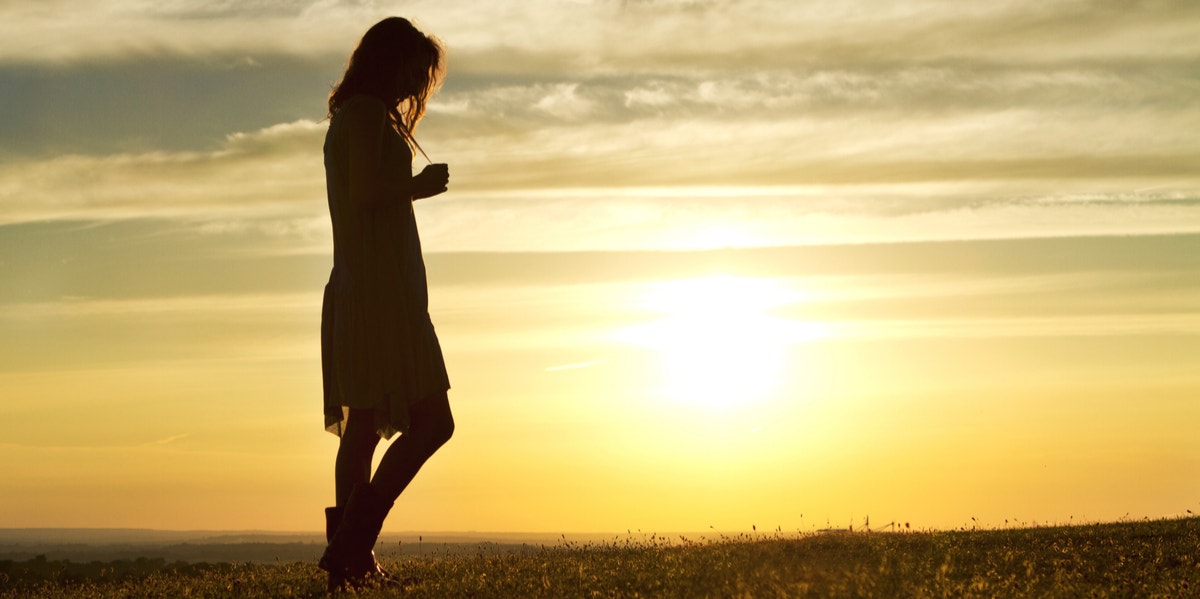 woman walking sunset