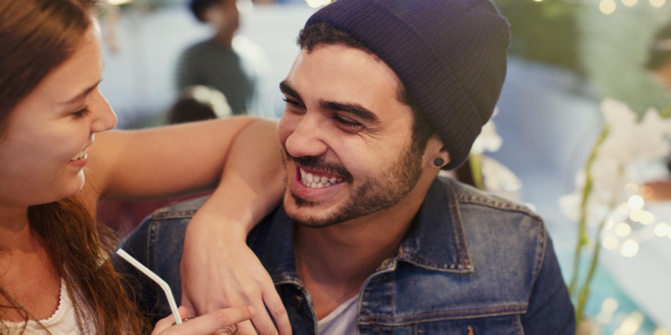 man and woman smiling at each other