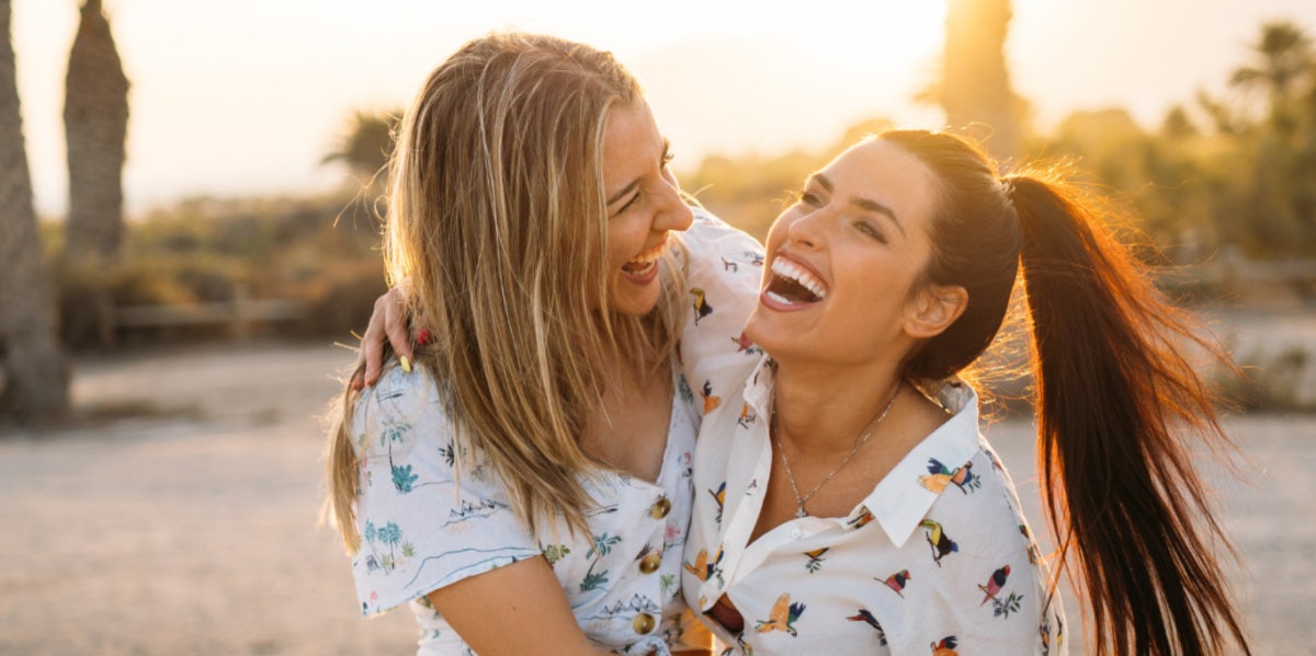 woman holding up other woman