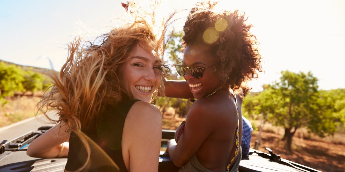 two happy women under the sun